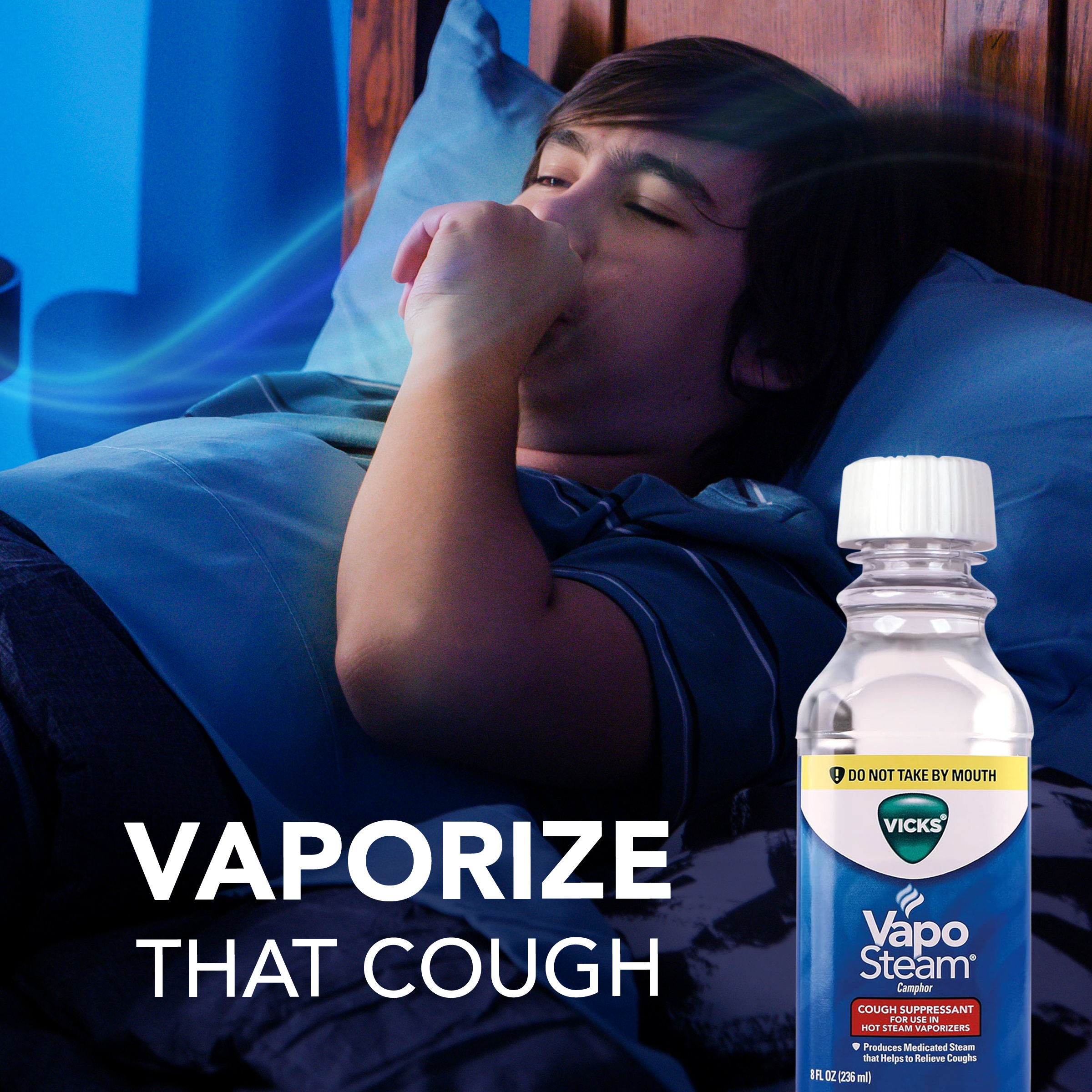A boy cough coughing while sleeping with text Vaporize that Cough and image on Vicks Vaposteam