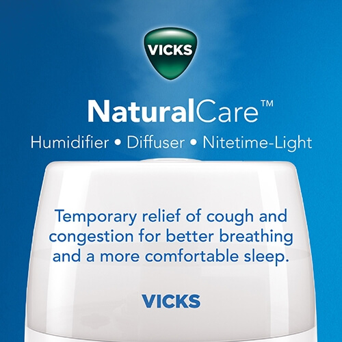 Vicks NaturalCare™ Cool Mist Ultrasonic Humidifier releasing mist in the air with text Temporary relief of cough and congestion for better breathing and a more comfortable sleep