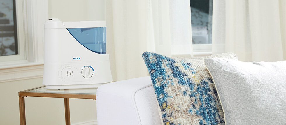 A Vicks Humidifier humidifying a room to help with dry skin