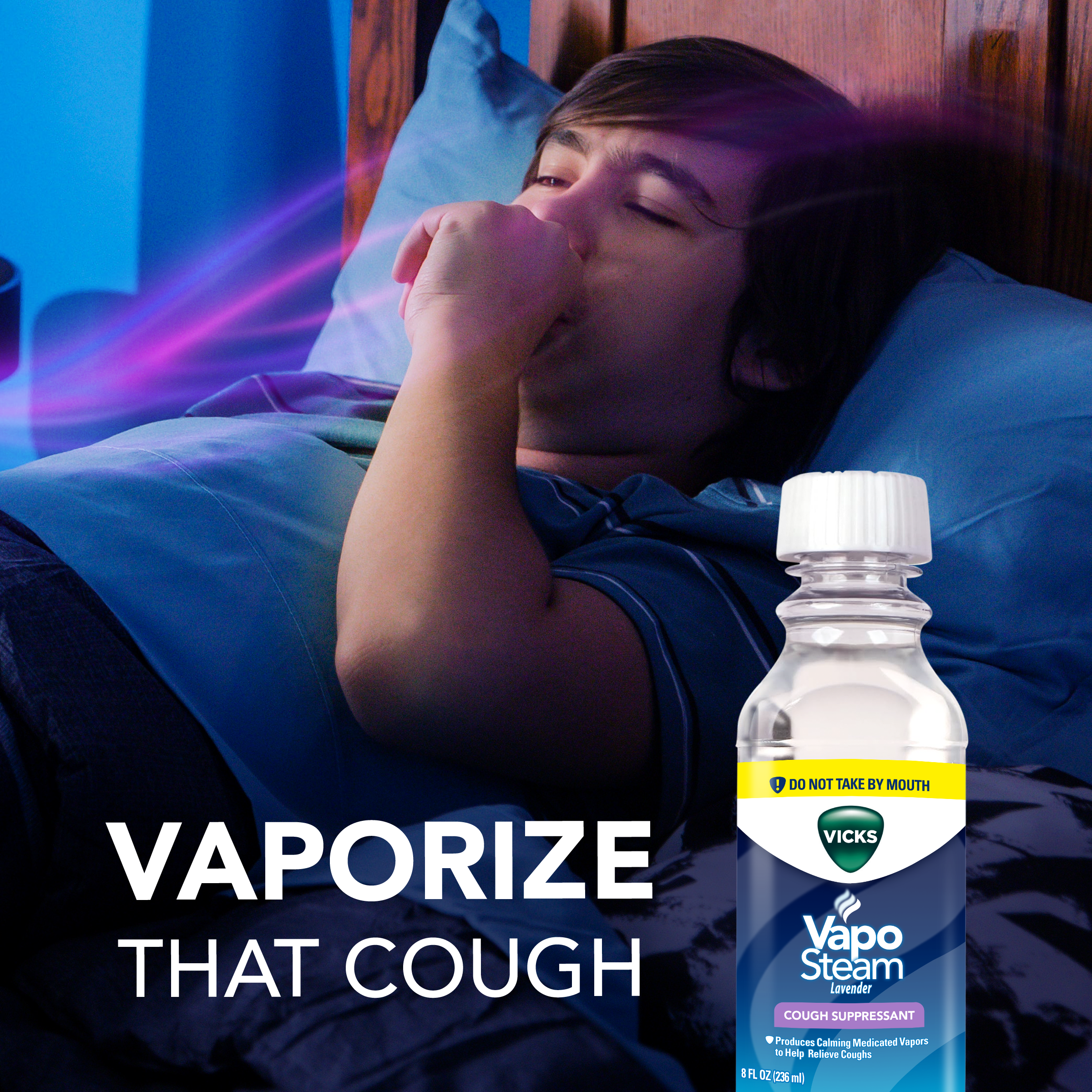 A boy cough coughing while sleeping with text Vaporize that Cough and image on Vicks Vaposteam Lavender bottle