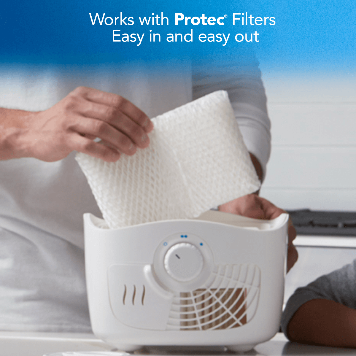 A person inserting the Protec filter in Vicks Filtered Cool Mist Humidifier VEV400 to help breathe better during allergy and cold season